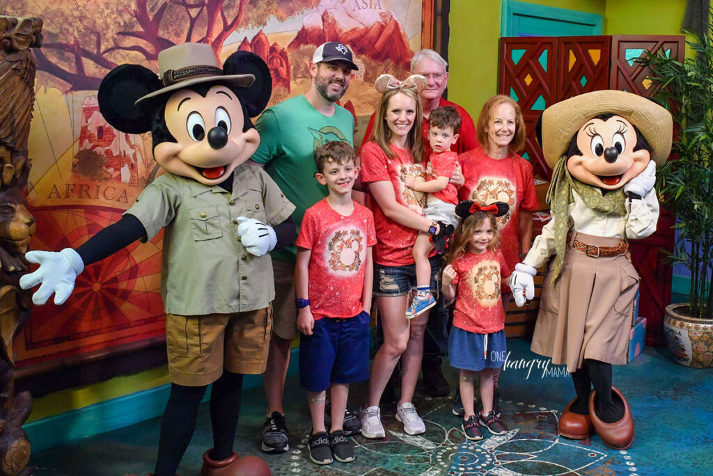 Family at Disney World with Toddlers with Mickey Mouse and MInnie Mouse